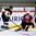 LUCERNE, SWITZERLAND - APRIL 24: Germany's Tobias Fohrler #5 slides the puck underneath the leg of Latvia's Eriks Zohovs #15 during relegation round action at the 2015 IIHF Ice Hockey U18 World Championship. (Photo by Matt Zambonin/HHOF-IIHF Images)

